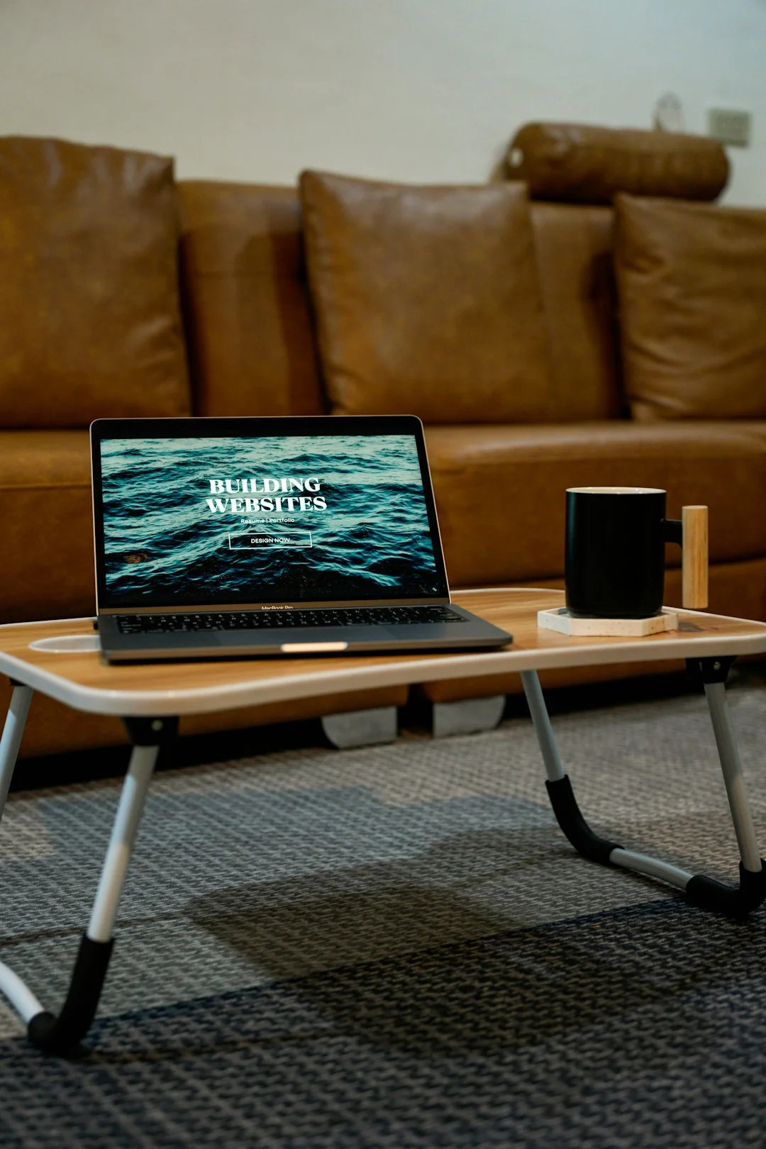 A creative workspace featuring UI design plans, pencils, a smartphone, and other office tools.